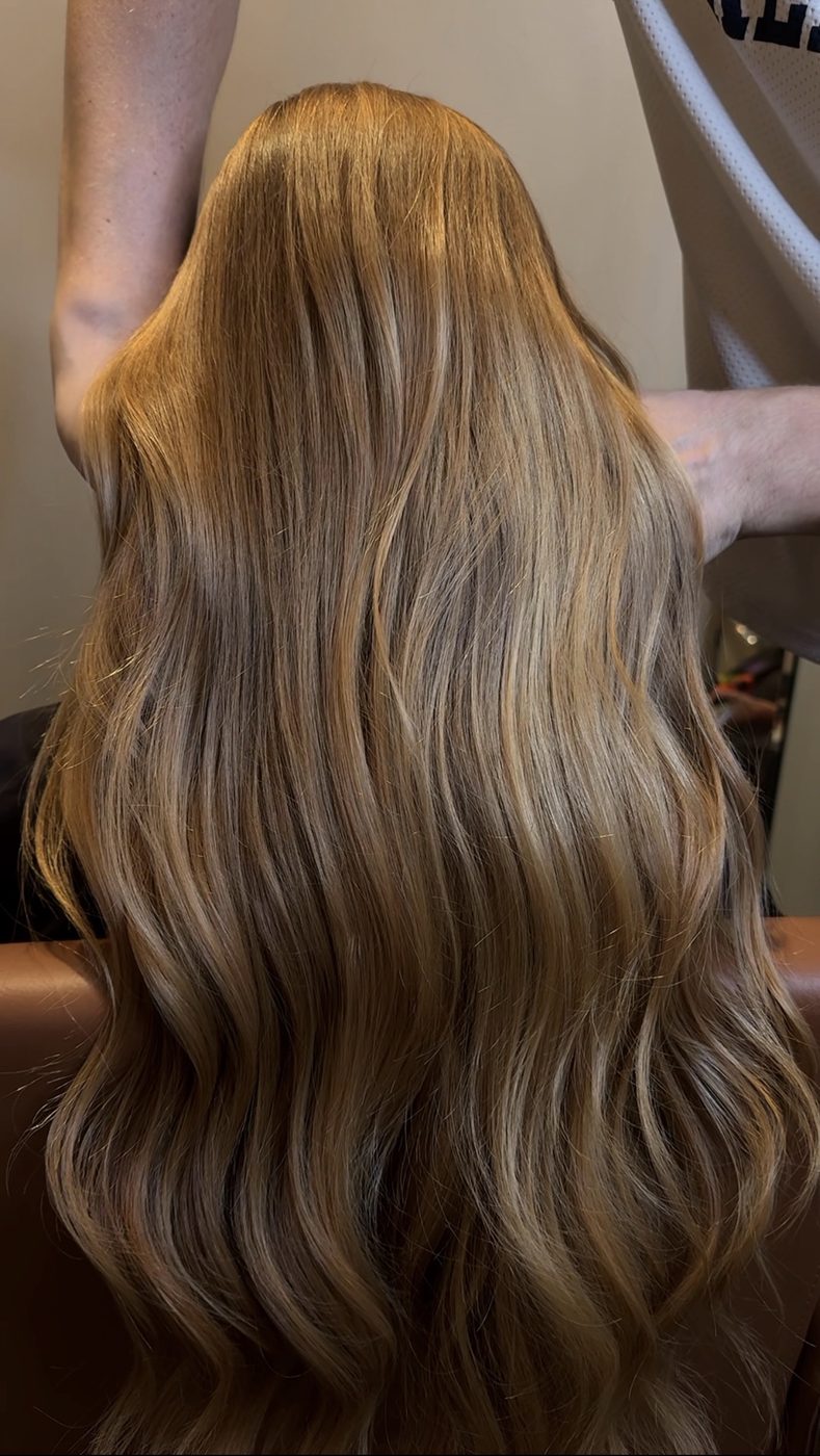 Warm caramel balayage long hair at LUV Beauty Club Miami