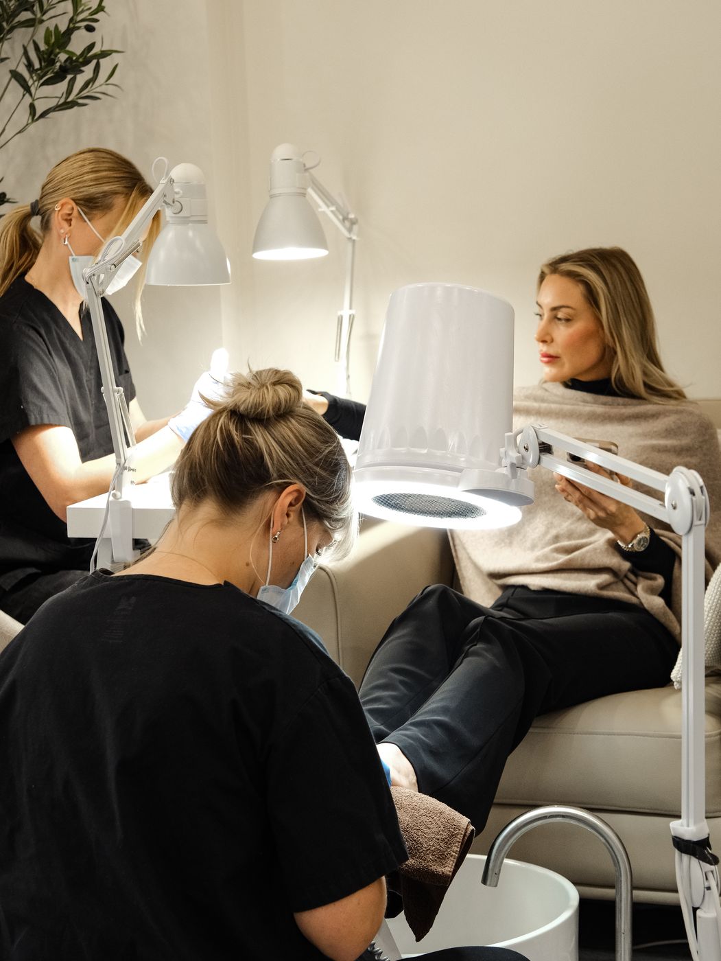 Clients enjoying manicure and pedicure services at LUV Beauty Club Miami