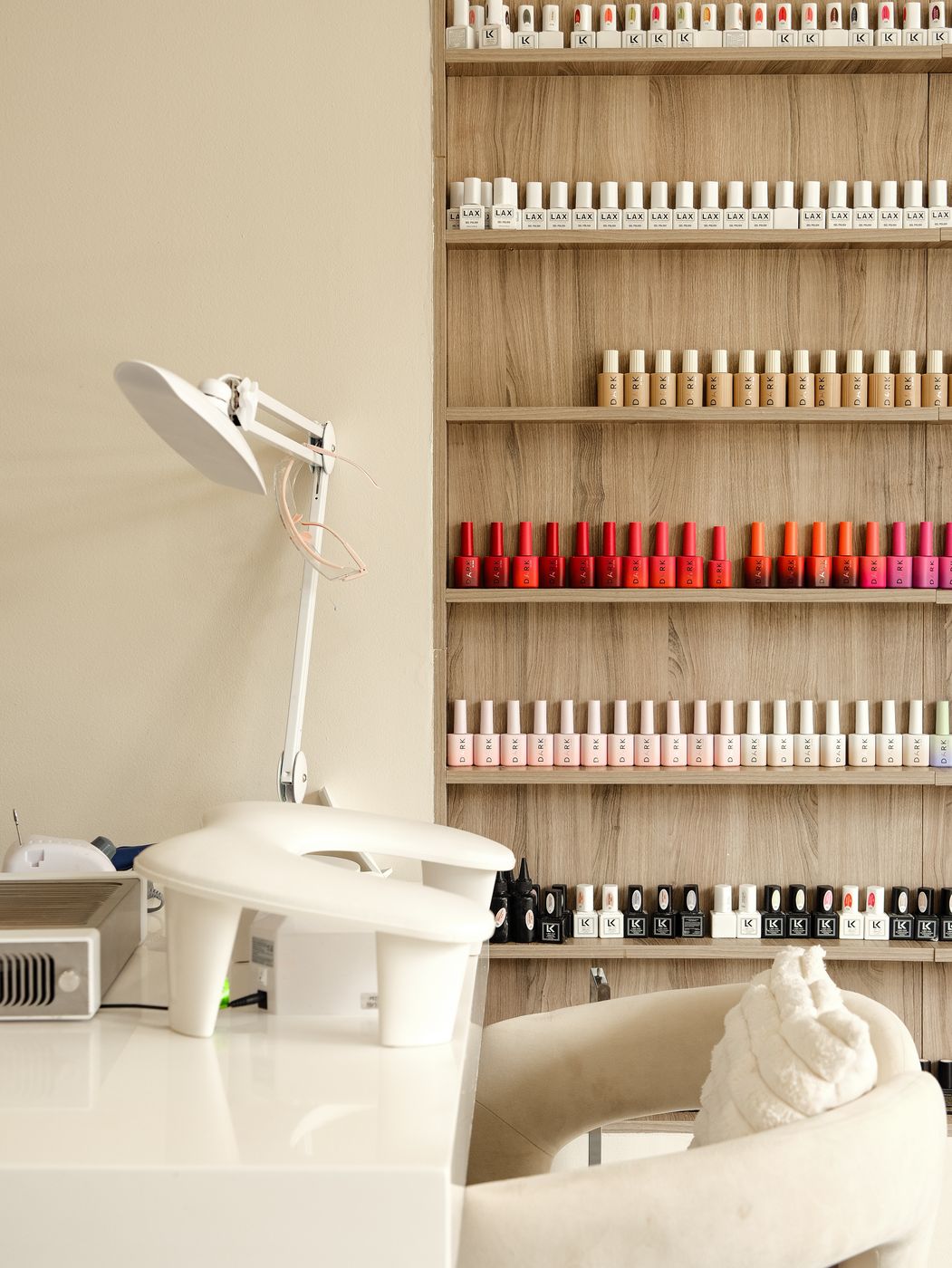 Gel polish color wall and manicure table at LUV Beauty Club Miami